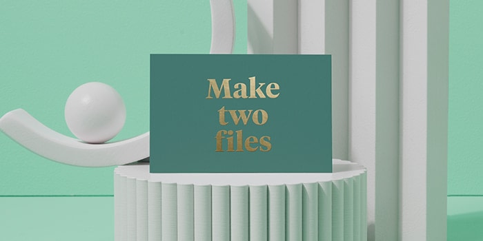 Green postcard with gold foil text saying make two files