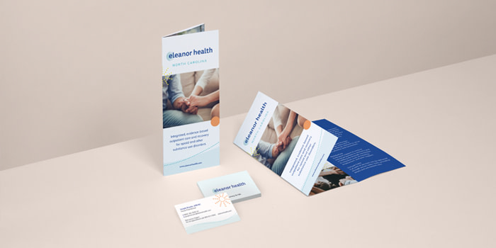 Folded flyers and business cards for Eleanor Health