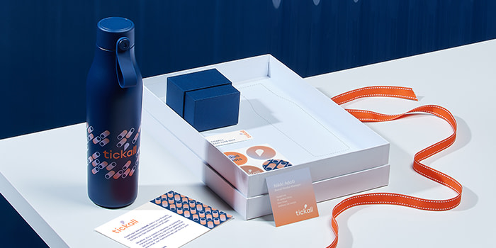 Gifting box with stickers, a display box and a blue water bottle with a colorful design