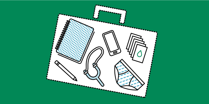 Illustration of a suitcase packed with travelling essentials 