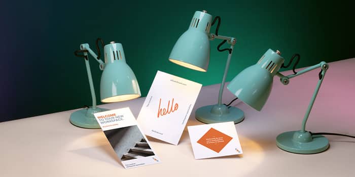 Cards in various sizes under lamps
