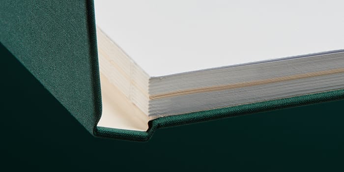 Closeup of an alpine green notebook with Swiss binding