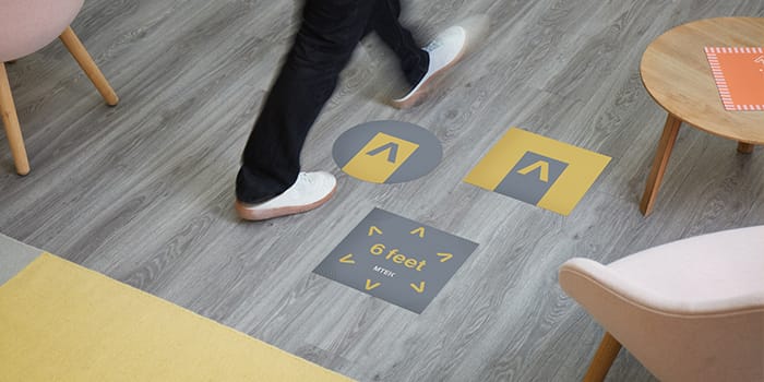 Floor decals for easy social distancing in the office
