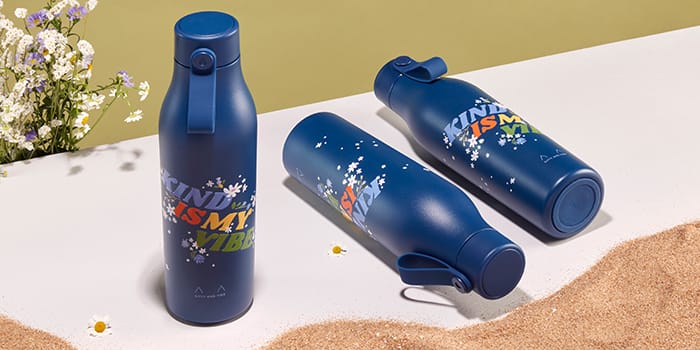 Blue reusable water bottles by Kitty and Vibe and MOO