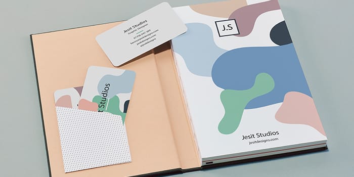 Business cards in the inner pocket of a MOO Notebook