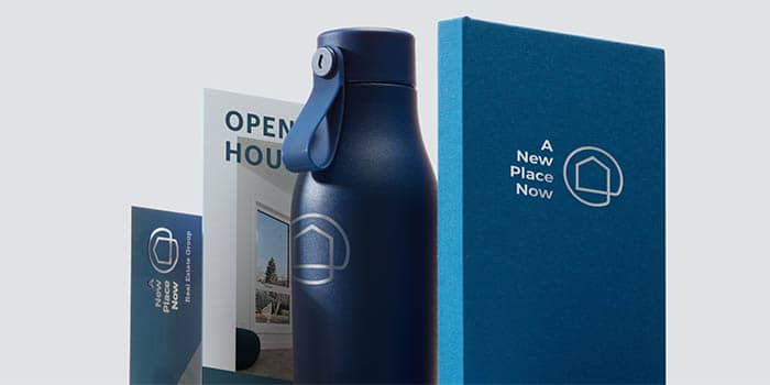 Custom water bottle, planner and print products available with MOO business solutions