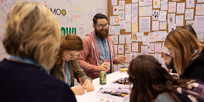 branded workspace with employees embracing the MOO company culture