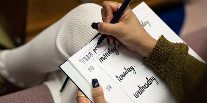 Jaslene doing lettering in her MOO notebook