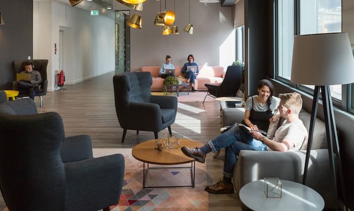 People chatting in a modern office