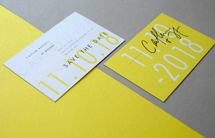 The Letterist yellow save the date cards