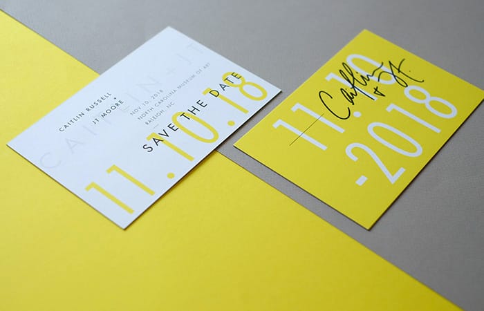 The Letterist yellow save the date cards