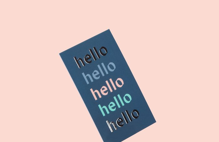 Blue business card with special finish text saying "hello"