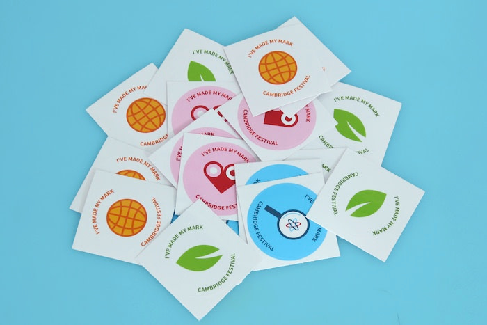 Round Cambridge Festival stickers with 4 different colorful designs by Elizabeth Inkim