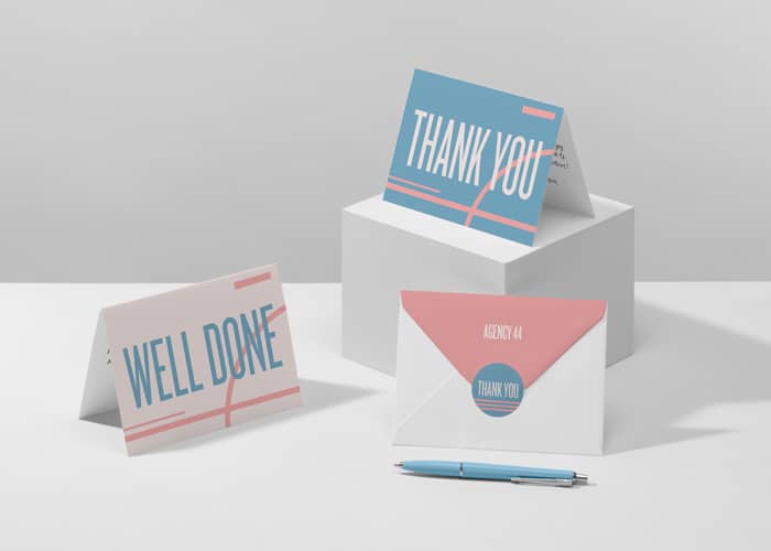 Consistent branding shown across thank you cards, greeting cards, and customized envelopes.