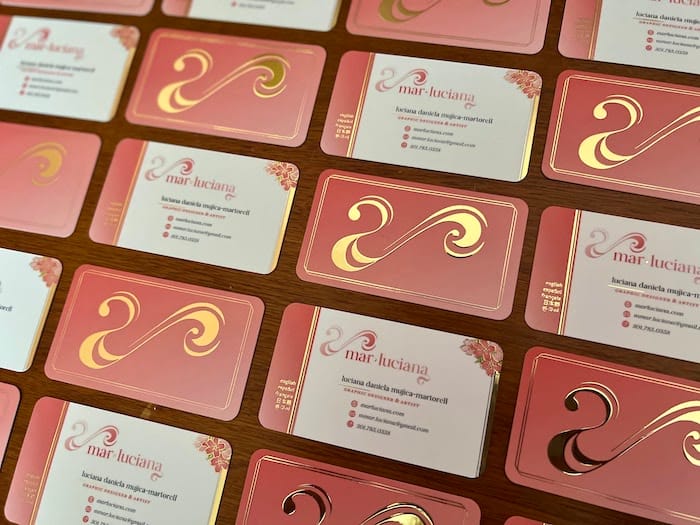 Pink business cards with gold foil designs by Mar Luciana