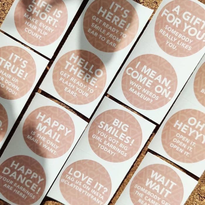 Round stickers with fun messaging on clay colored background by Clayd by Tiffany