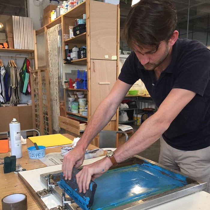 Tom Maryniak working with woodcut