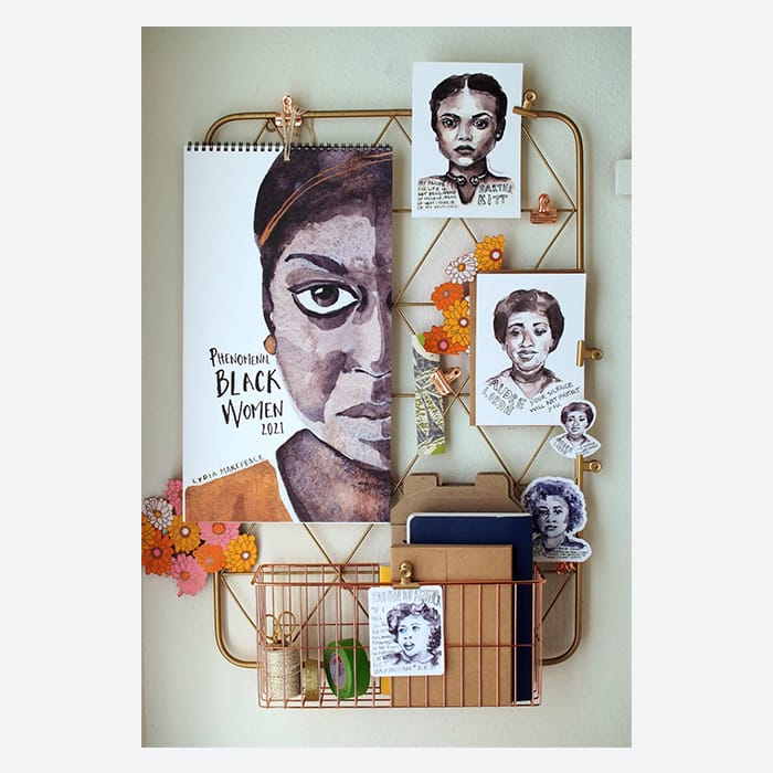 Phenomenal Black Women calendar and postcards by Lydia Makepeace on a wall grid