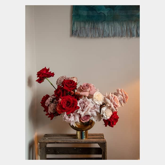 Rose bouquet on a table by Rooted in Rosemary floral design studio in Oxford