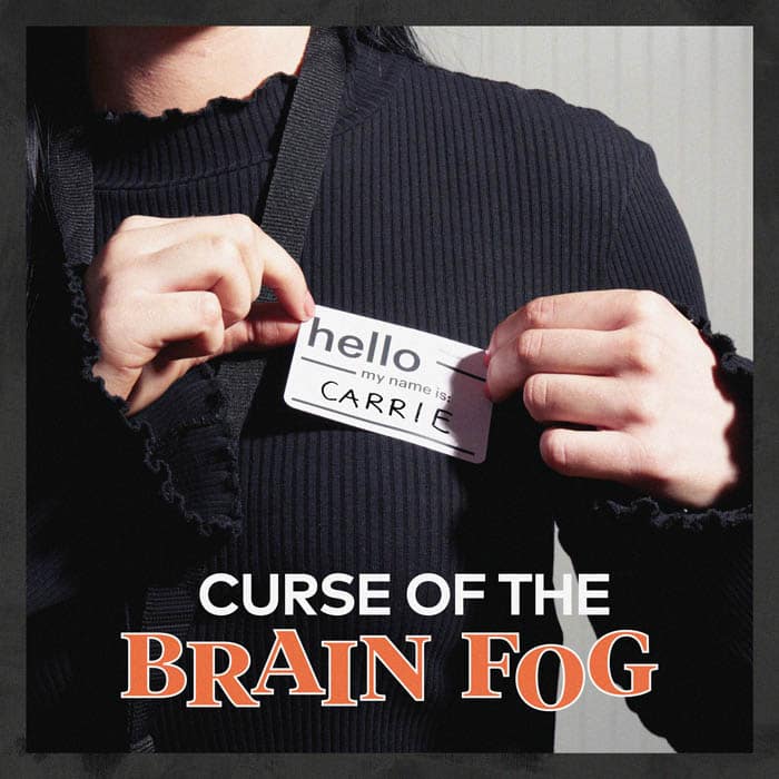 Person adding a name tag label on their shirt with overlay text that reads "curse of the brain fog"