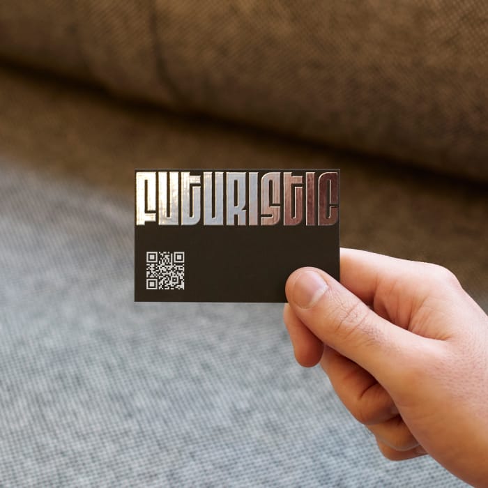 An eye-catching business card with funky and bold silver foil and a QR code in the corner.